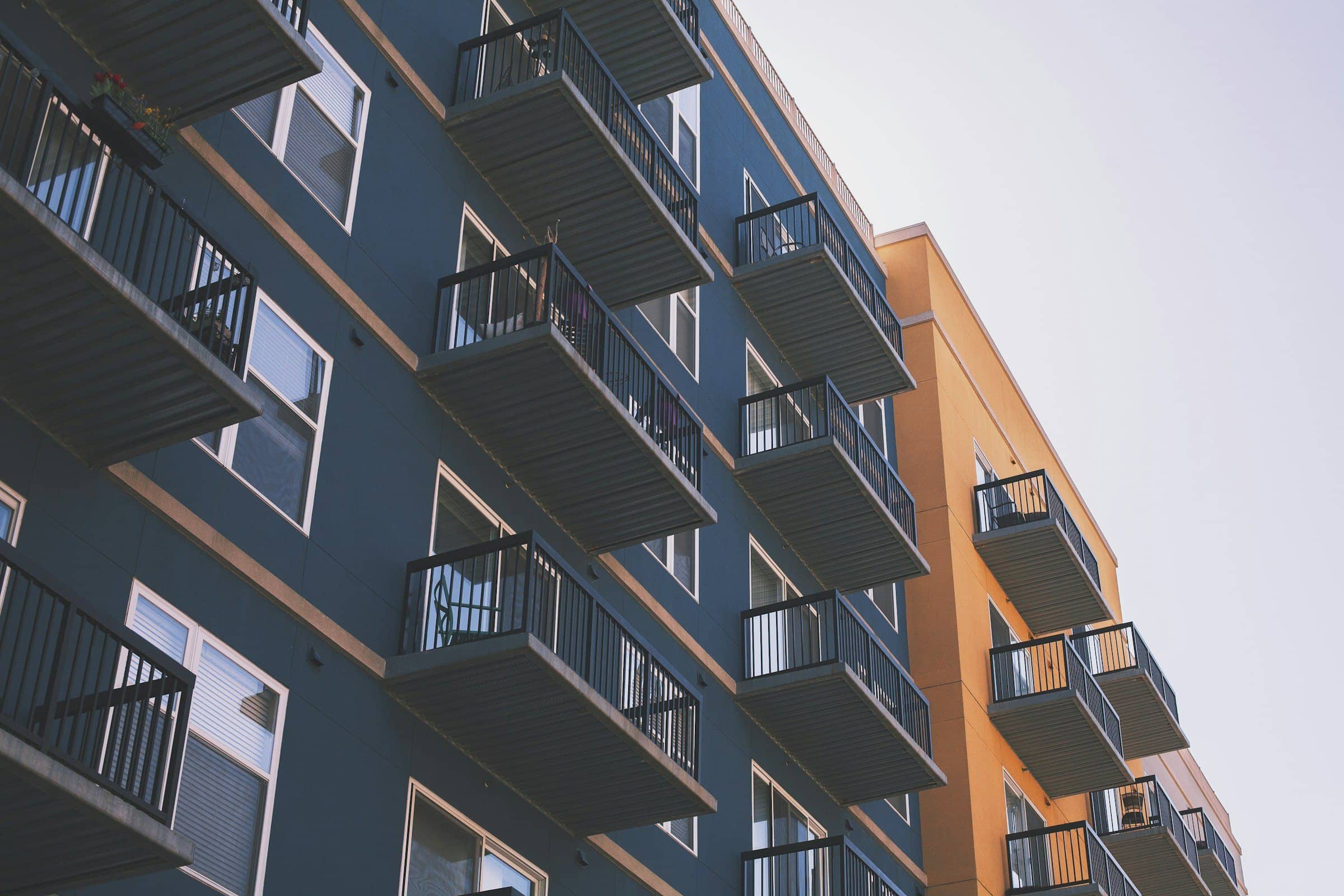 Multifamily residential building with stacked private balconies